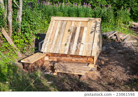 New wooden water well at the village in summer day 23061598