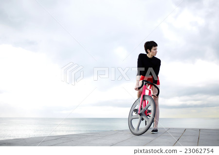 Female cyclist resting after ride Female cyclist resting after ride 23062754