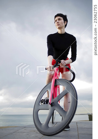 Female posing with bike  23062755