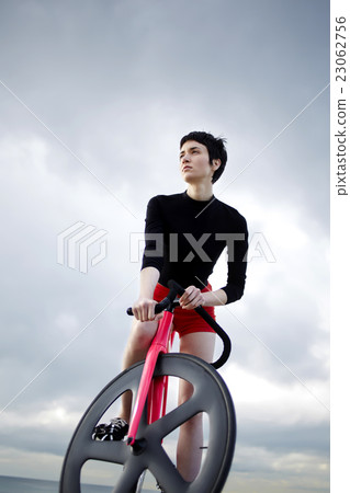 Beautiful woman resting after ride on sport bike Beautiful woman resting after ride on sport bike 23062756