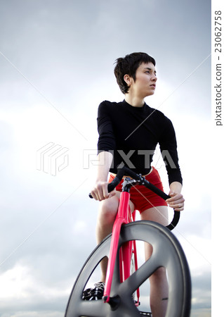 Woman enjoy active weekend while riding on bike Woman enjoy active weekend while riding on bike 23062758