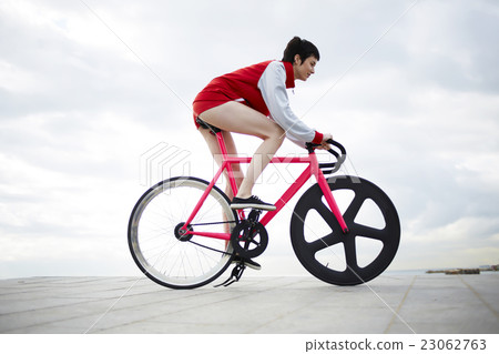 Female riding on bike Female riding on bike 23062763