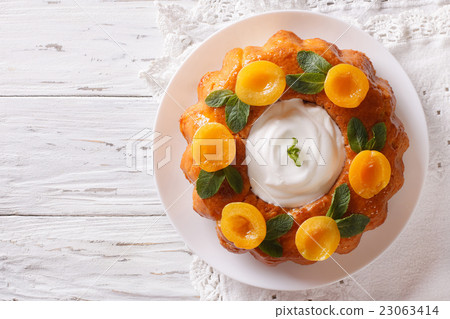 Savarin French dessert with apricots 23063414
