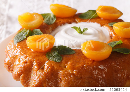 Savarin French dessert with apricots 23063424