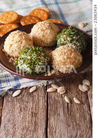 Goat Cheese balls with crackers, herbs Goat Cheese balls with crackers, herbs 23063434