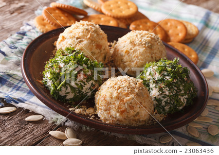Goat Cheese balls with crackers, herbs  23063436