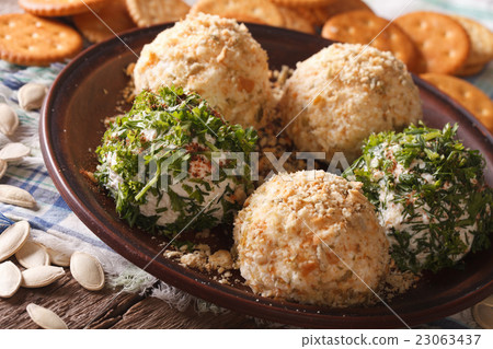 Curd cheese balls with crackers, herbs 23063437