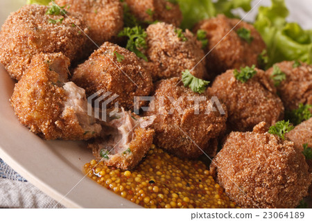 Bitterballen veal with mustard on a plate 23064189
