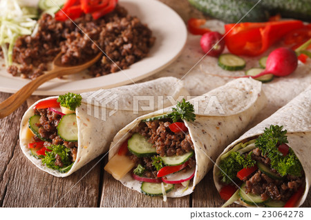 Tortilla rolls with minced meat, vegetables 23064278