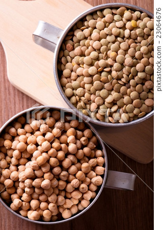 Top view on two old aluminum cups with chickpeas  23064676
