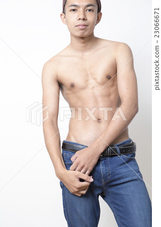 Men's beauty image whole body stand up jeans camera eye line hairband white back Men's beauty image whole body stand up jeans camera eye line hairband white back 23066671