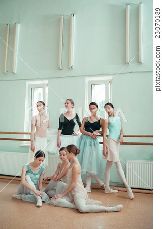 The seven ballerinas at ballet bar 23070189
