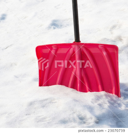 .Red plastic shovel for snow removal. .Red plastic shovel for snow removal. 23070739