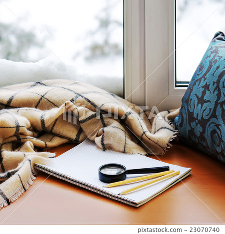 Open notepad, magnifier glass, pillow, pencils Open notepad, magnifier glass, pillow, pencils 23070740
