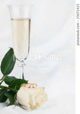 Rings, rose and champagne glass Rings, rose and champagne glass 23072425