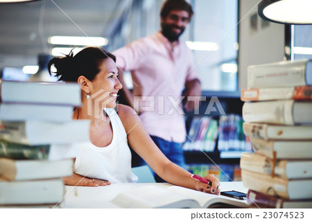 Female having fun with her male classmate Female having fun with her male classmate 23074523