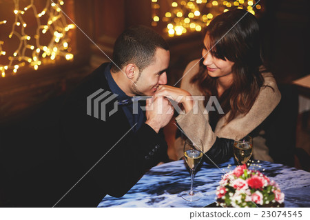 Couple enjoying each other's in a romantic dinner Couple enjoying each other's in a romantic dinner 23074545