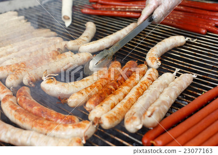 Street fast food, grilled sausages at bbq Street fast food, grilled sausages at bbq 23077163