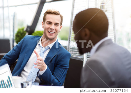 Positive man talking with his colleague Positive man talking with his colleague 23077164