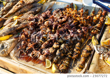Seafood, fish, octopus grilled at barbecue Seafood, fish, octopus grilled at barbecue 23077272