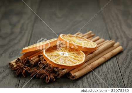 true cinnamon sticks and dried oranges 23078380