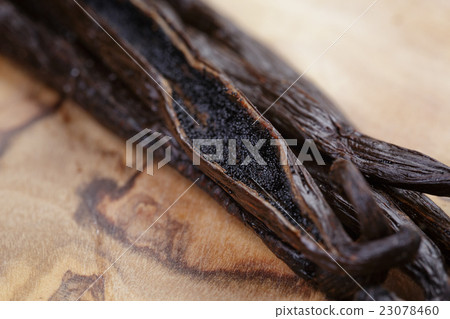 open vanilla pod on olive board open vanilla pod on olive board 23078460