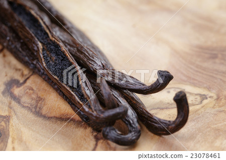open vanilla pod on olive board open vanilla pod on olive board 23078461