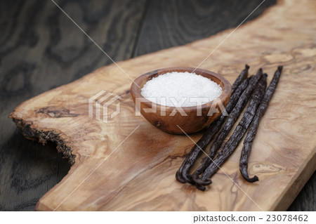 bourbon vanilla pods with white sugar on table bourbon vanilla pods with white sugar on table 23078462