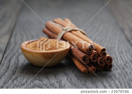 bunch of cinnamon sticks tied with twine bunch of cinnamon sticks tied with twine 23078598