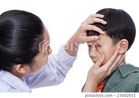 Asian boy with an injured eye.  23082632