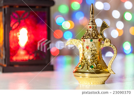 Golden Arabic Coffee pot in colorful background. Golden Arabic Coffee pot in colorful background. 23090370