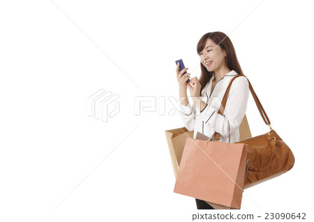 A young woman who enjoys shopping A young woman who enjoys shopping 23090642