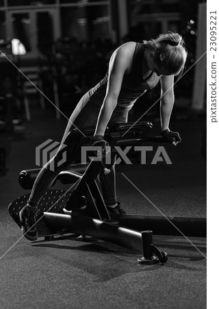 Woman doing strength exercises for abs muscles Woman doing strength exercises for abs muscles 23095221