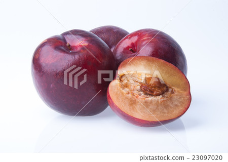 Plum. Ripe plum fruit on background 23097020