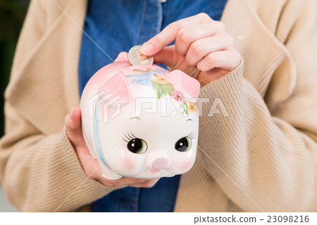 A woman saving money 23098216