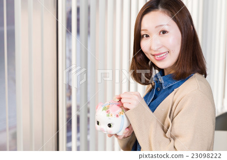 A woman saving money 23098222