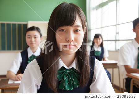 Junior high school students who have uneasy faces to take classes at school Junior high school students who have uneasy faces to take classes at school 23098553