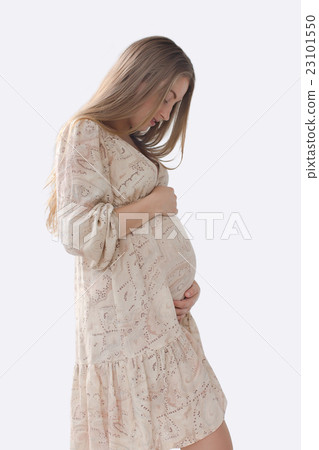 Silhouette pregnant woman holding her belly Silhouette pregnant woman holding her belly 23101550