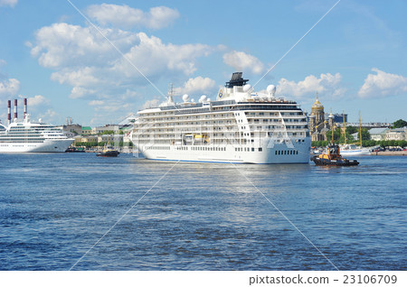 ship tug turning a large ocean liner ship tug turning a large ocean liner 23106709