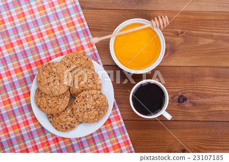 Coffee cup biscuits and honey lies . Coffee cup biscuits and honey lies . 23107185