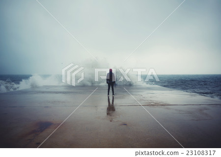 Male person enjoying rainy day alone 23108317