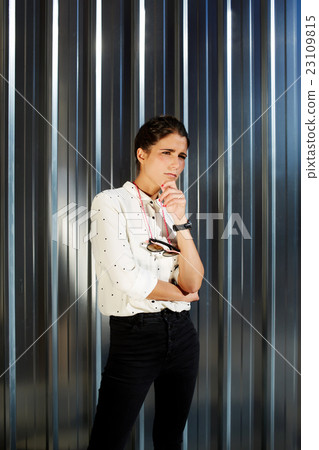 Trendy hipster girl standing outdoors 23109815
