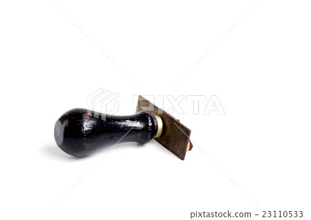 Black rubber wooden stamp on white background Black rubber wooden stamp on white background 23110533