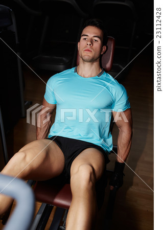 Young man having hard fitness training Young man having hard fitness training 23112428