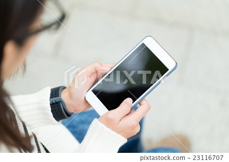 Top view of woman use of mobile phone 23116707