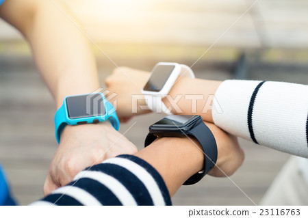 Friends using smart watch together 23116763