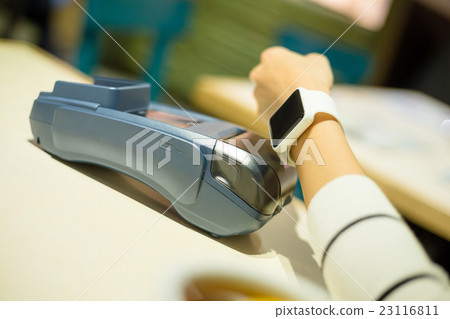 Customer using smart watch to pay Customer using smart watch to pay 23116811