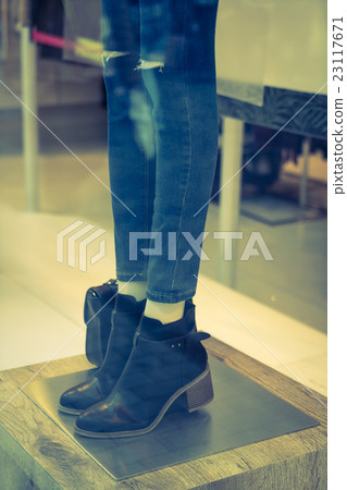 Woman dressed mannequins In Fashion Shop . ,Filtered image processed vintage effect. 23117671