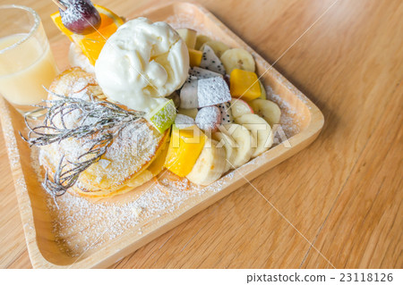 Pancake and fruit with ice cream on table . Pancake and fruit with ice cream on table . 23118126