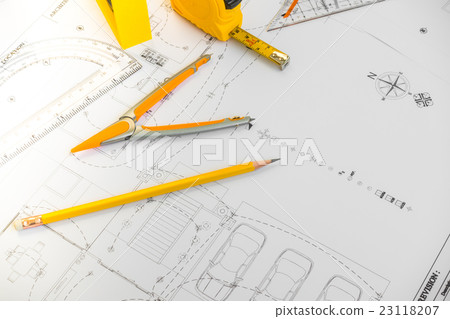 Construction plans with yellow helmet and drawing tools on blueprints . Construction plans with yellow helmet and drawing tools on blueprints . 23118207